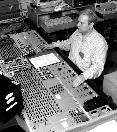 Engineer at audio console at Danish Broadcasting Corporation